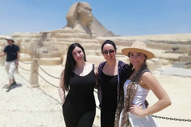 Giza Pyramids, Ride a Camel, Sphinx, Egyptian Museum& Bazaar, Lunch is included. - Standing before the three pyramids at Giza