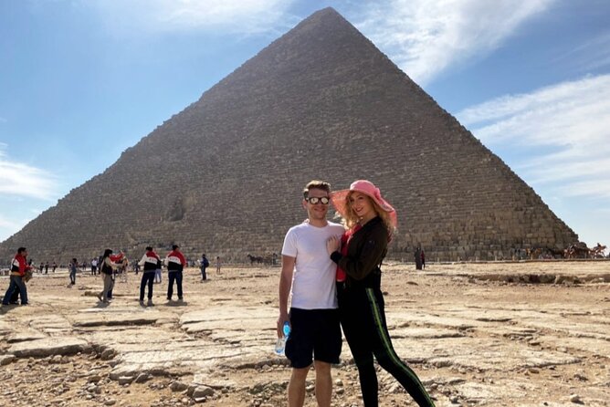 Half Day Tour to Giza pyramids, sphinx Lunch and camel ridding - A camel ride with the pyramids behind you