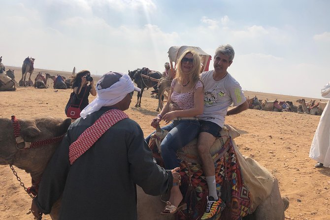 Half dayTour Pyramids of Giza Sphinx including Camel ride - A 30-minute camel ride on the plateau