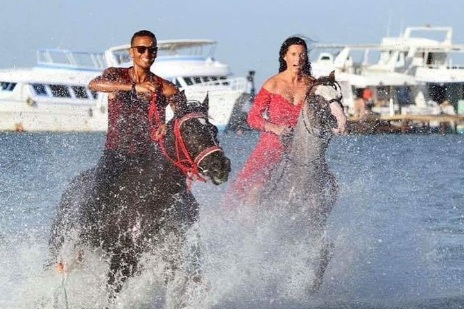 Horse Riding Tour 2 Hours on Sea And Desert & Transfer -Hurghada - The beach ride and the famous sea photograph