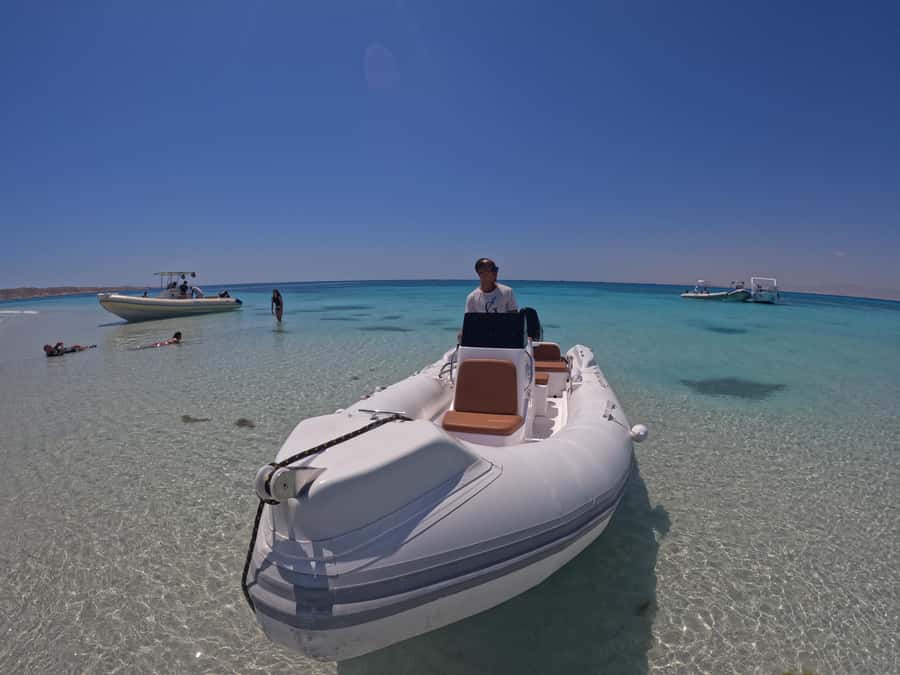 Hurghada: 4 Island Hopping Tour Dolphin, Snorkeling & Lunch - Looking for dolphins in open water