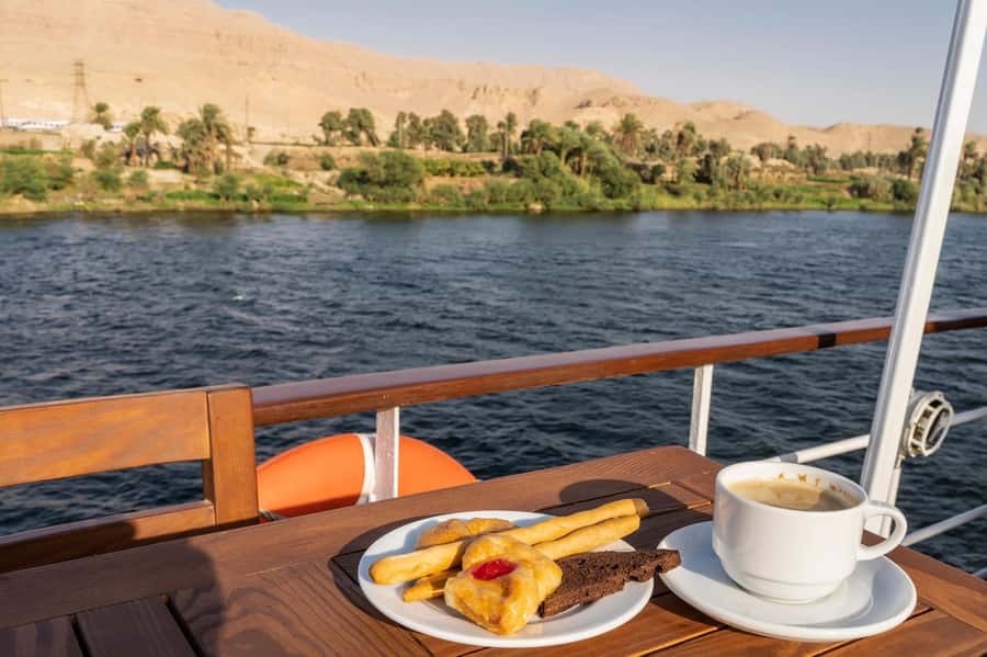 Luxor: One-night Nile Cruise to Aswan with Transfer - Day one: pickup in Luxor and lunch afloat