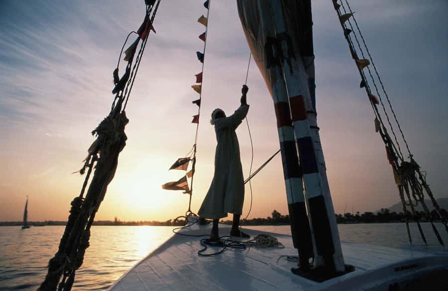 Luxor: Private Felucca Boat Trip with Hotel Pickup - Boarding a traditional felucca on the Nile