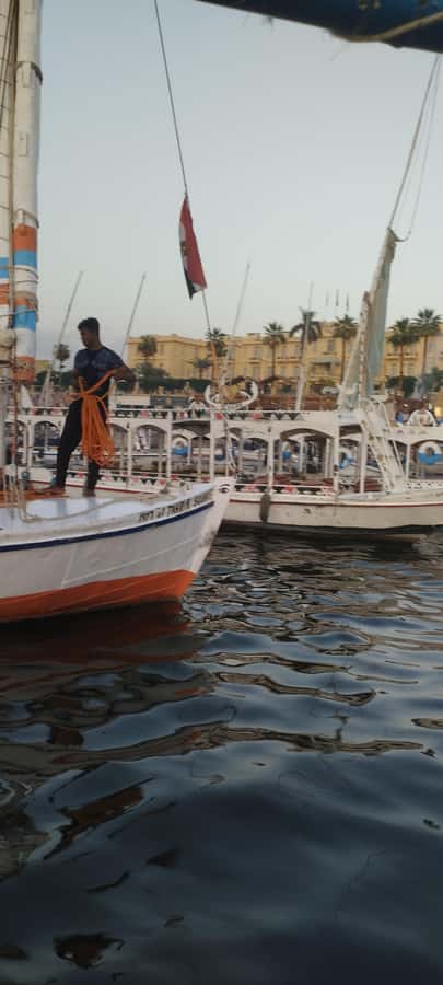 Luxor: Private Felucca Boat Trip with Hotel Pickup - The sunset return toward Luxor