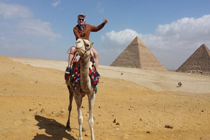 Private Experienced Tour for Camel ride during the sunset with Local Bedouin Dinner - A sunset view with the pyramids as your backdrop