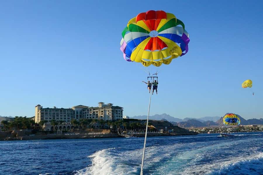 Sharm: Water Sports Adventure Day with Hotel Transfer - Seeing Red Sea coral from a glass-bottom boat