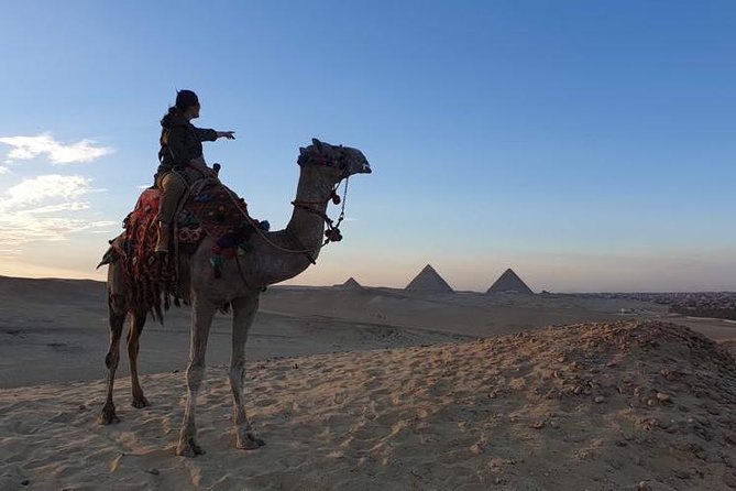 sunset at Giza pyramids by camels - A Sunset View Different From the Pyramid Grounds