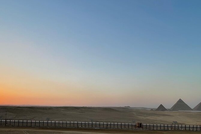 sunset at Giza pyramids by camels - Photographs With the Pyramids Behind You